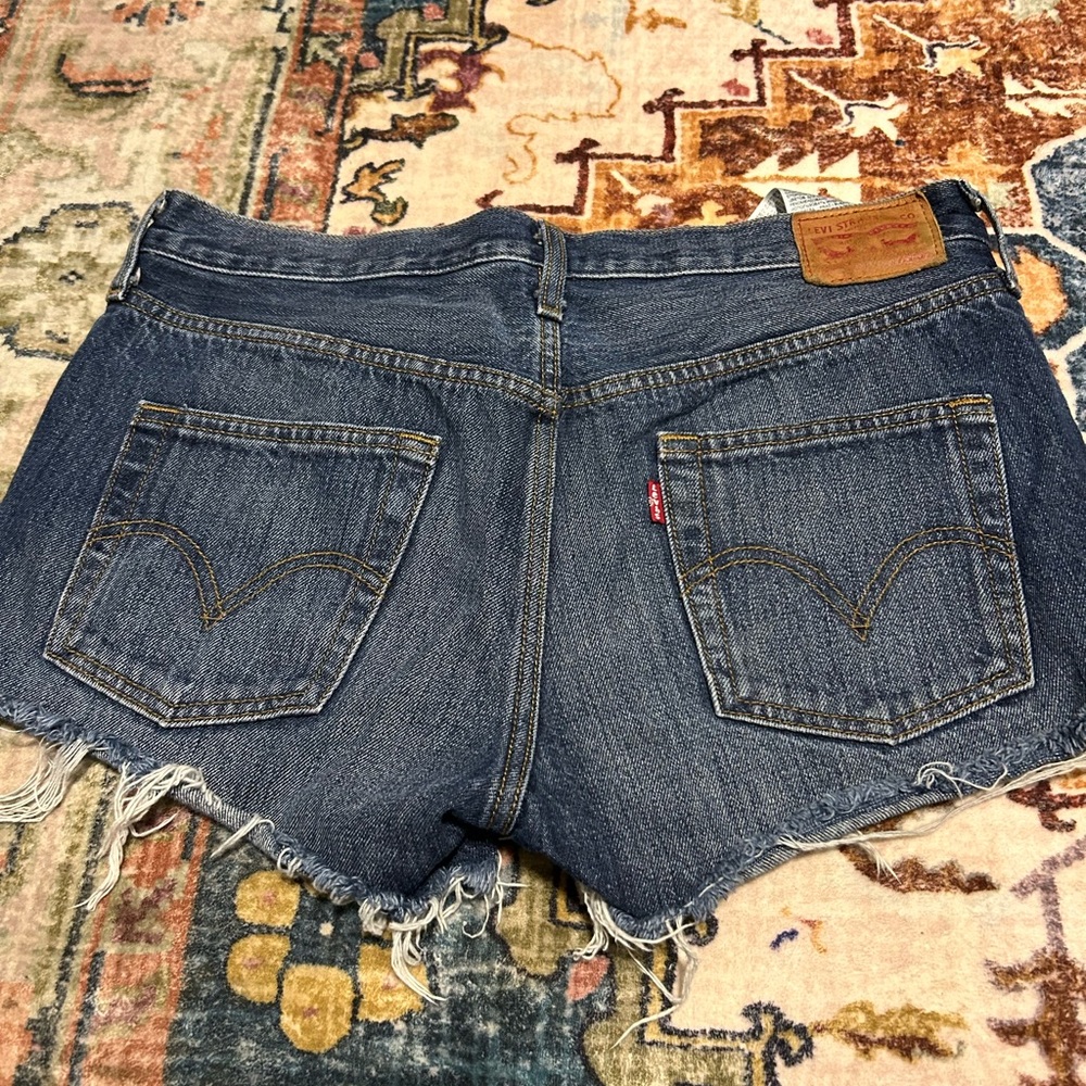 Women’s distressed Levi 501 blue Jean shorts size 28
